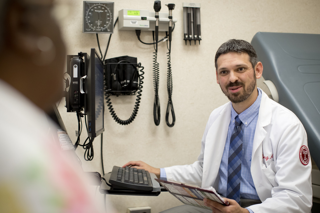 Pharmacist with a patient
