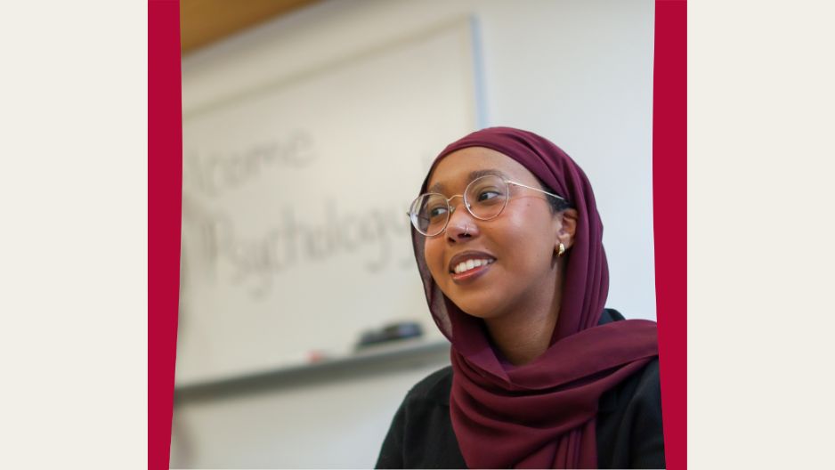 Rahma Goran is seated in a classroom looking away to the camera at people not shown in frame