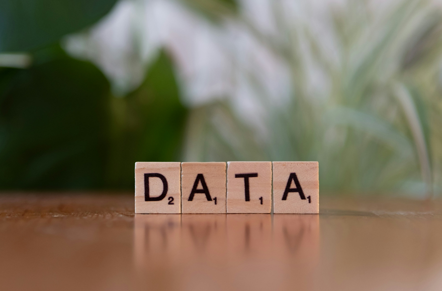 The word “data” spelled out in Scrabble letter tiles 