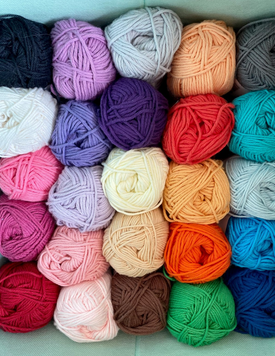 Five rows of yarn in a variety of colors. 