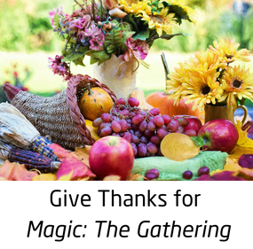 An image of a cornucopia with fruit and flowers on a table, with the text: Give Thanks for Magic: The Gathering 
