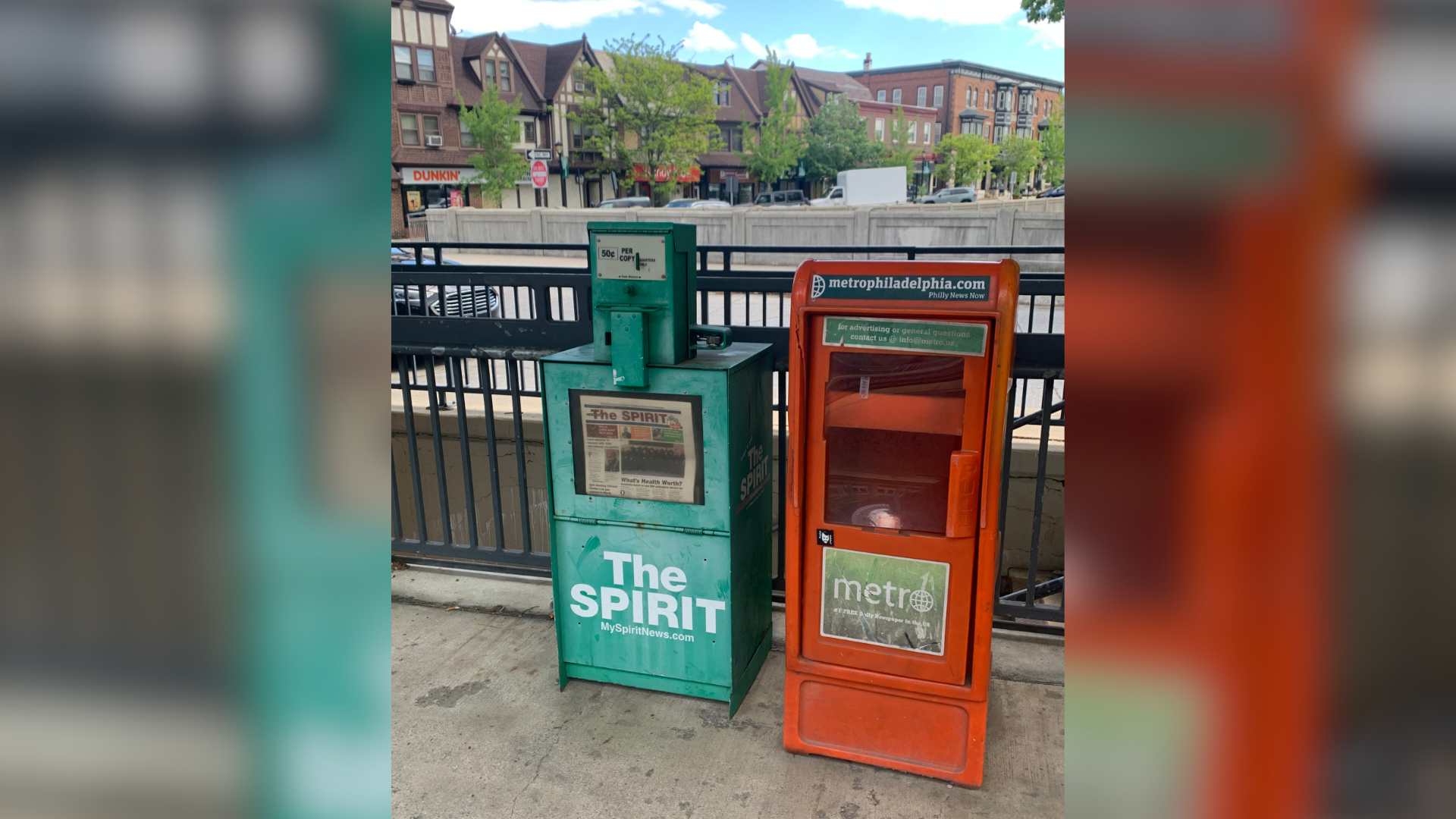 Newspaper boxes at train station