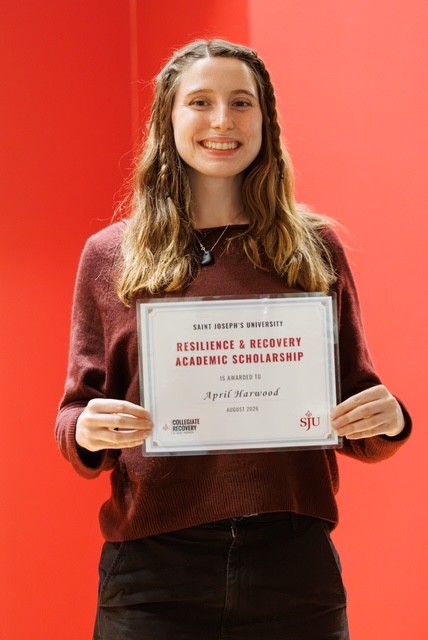 April Harwood poses with Resilience and Recovery Scholarship