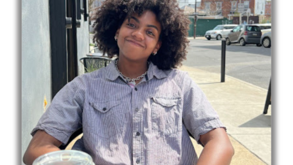 Lindsey Minor sitting at outdoor cafe table