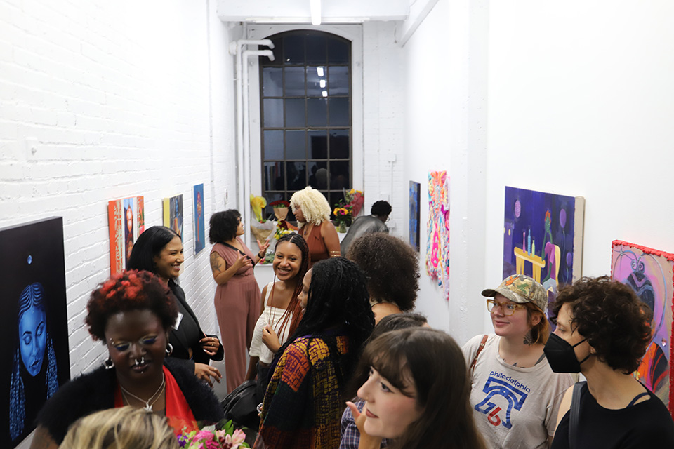 Luster Gallery + Studio filled with visitors during its first exhibition opening