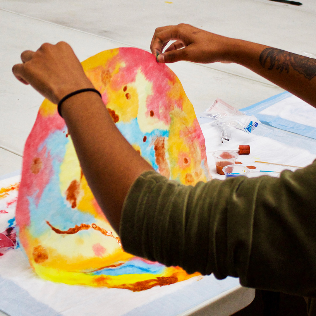 student participating in a project with Art Therapy