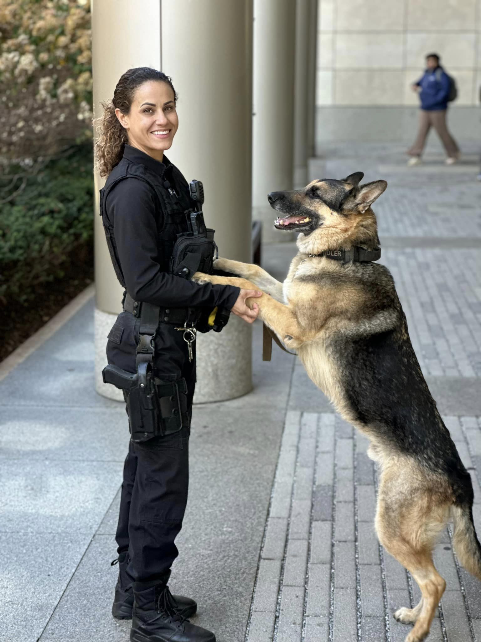 Temple Police Officer Natalie Sherman patrols Main Campus with K9 Officer Chandler.