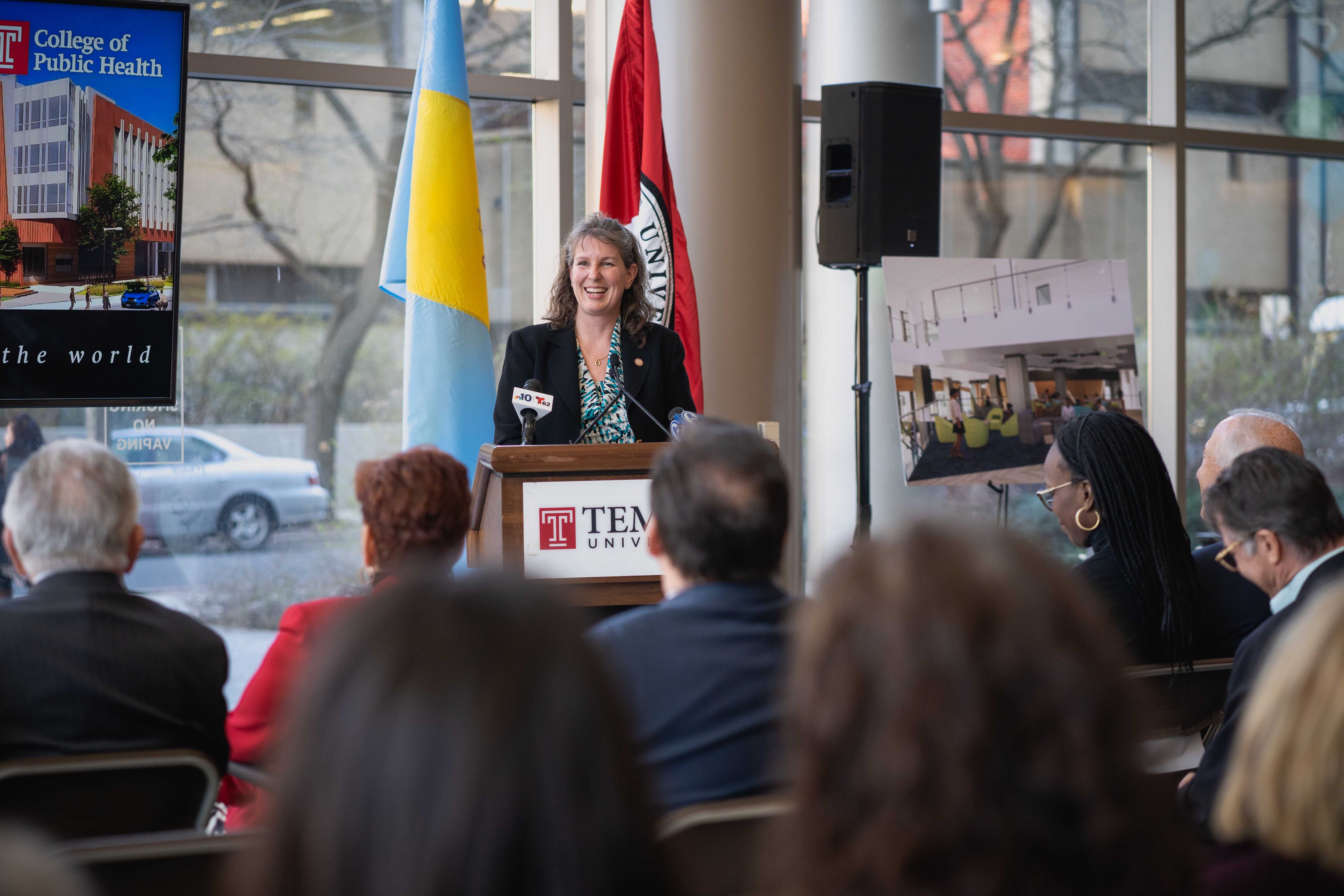 Jennifer Ibrahim standing at a podium