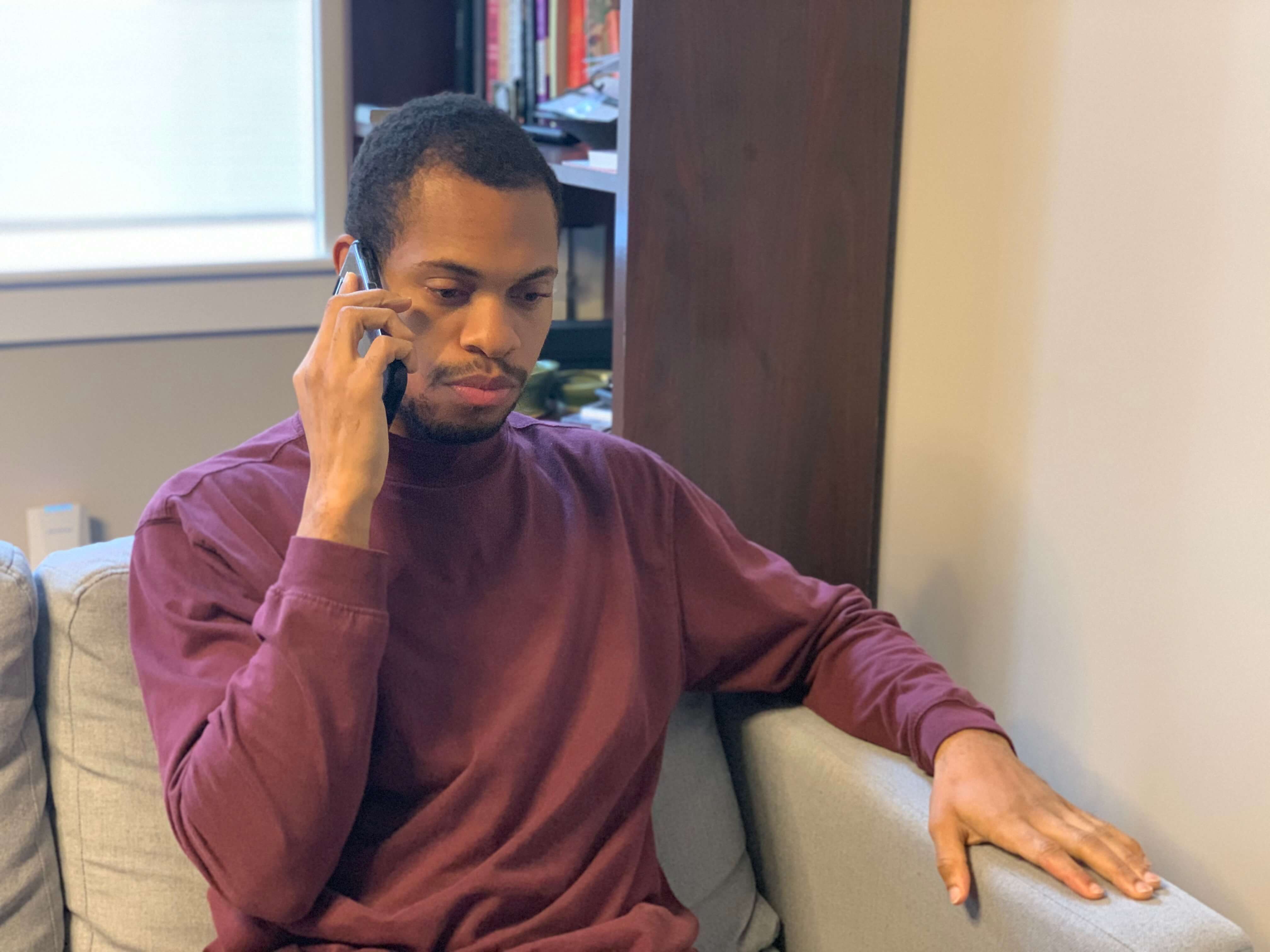 A Temple student volunteer calls a patient in hospital.