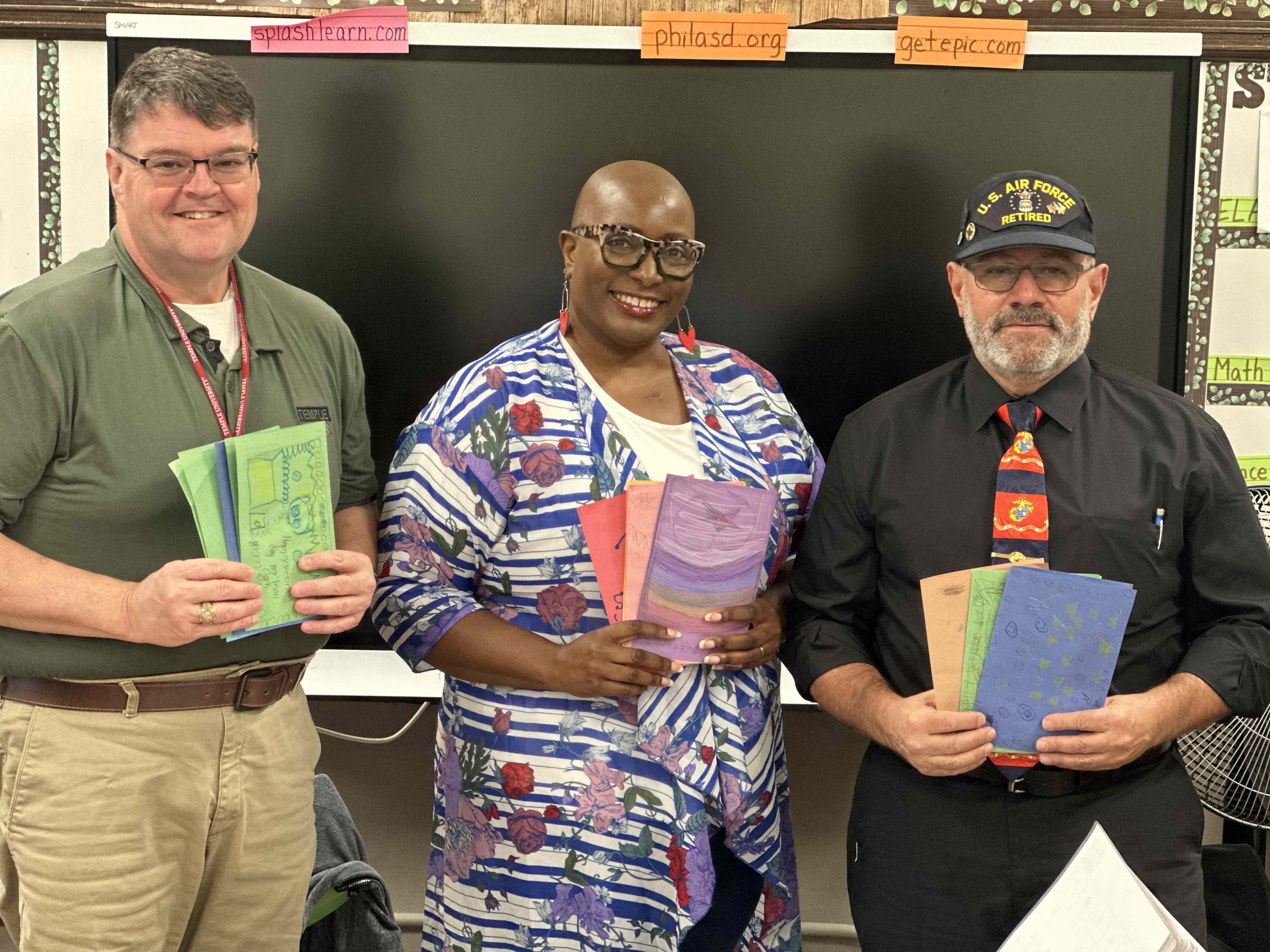 Len Clark, director of emergency management (left), standing next to third-grade teacher Ms. Berry and Joe Spera (right), director of technology for Temple s Public Safety Department. Clark and Spera are both veterans and spoke to Ms. Berry's class about Veterans Day.