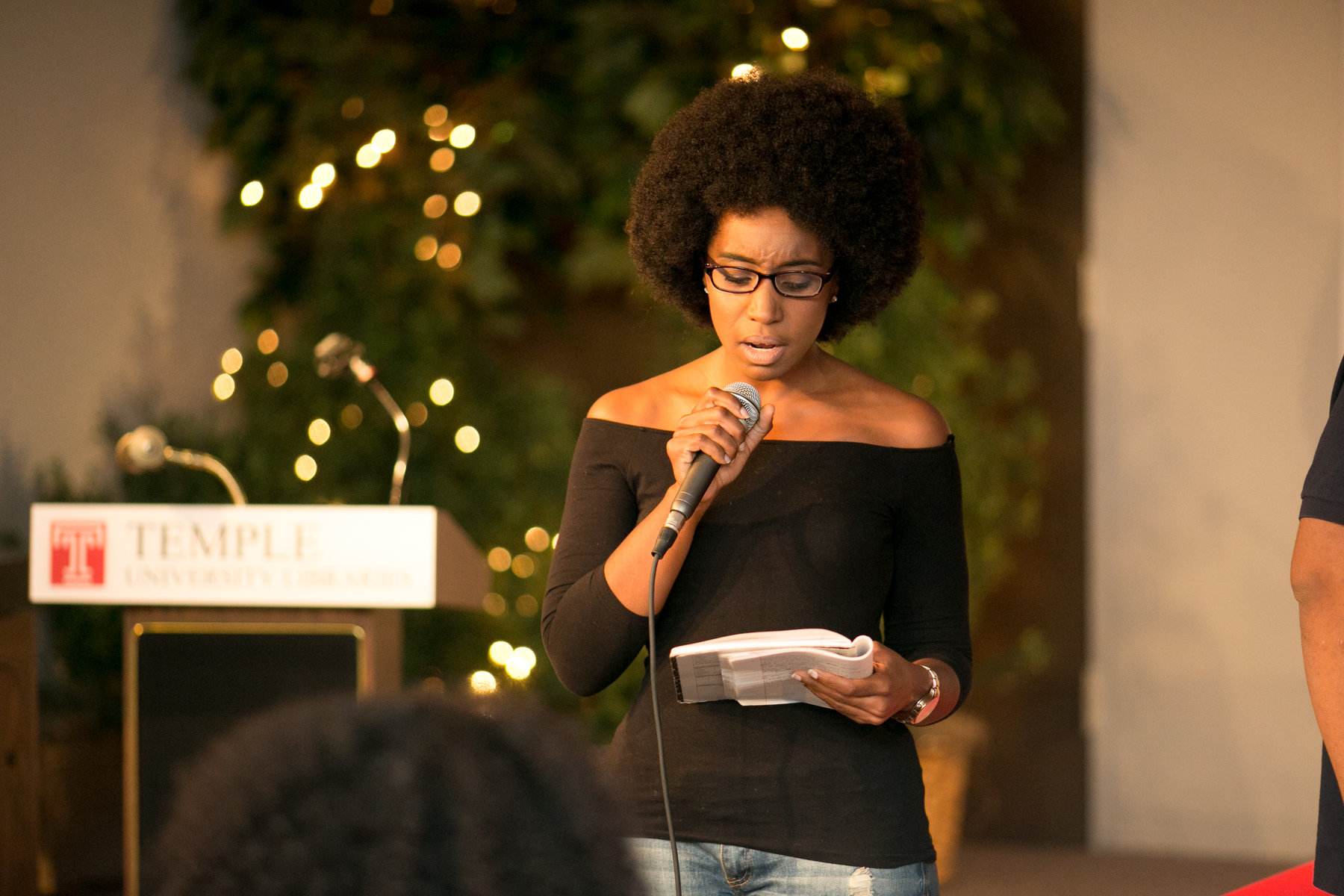 student reading poetry