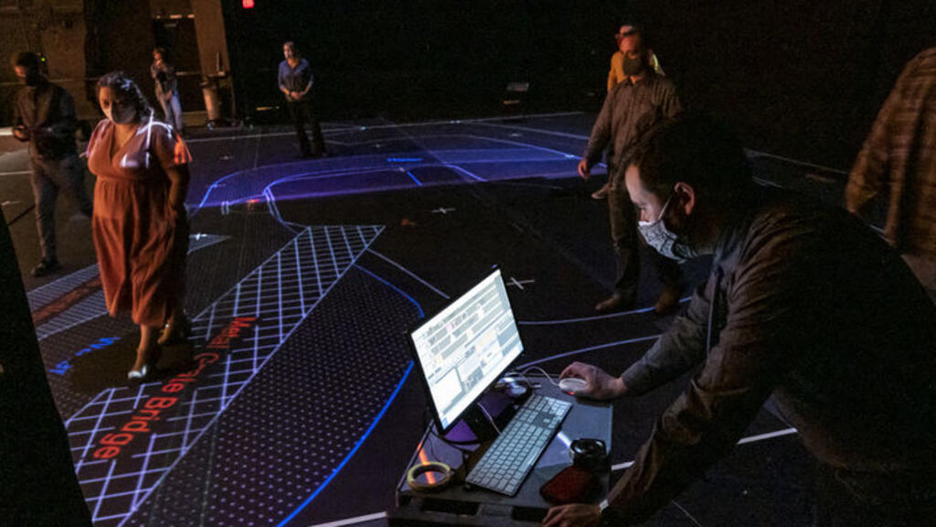 Temple University faculty try out a new projection mapping system.