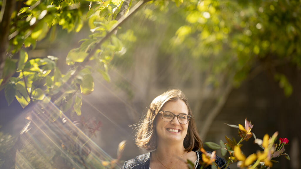 Temple researcher Meghan Kane in Founder's Garden on Temple's campus.