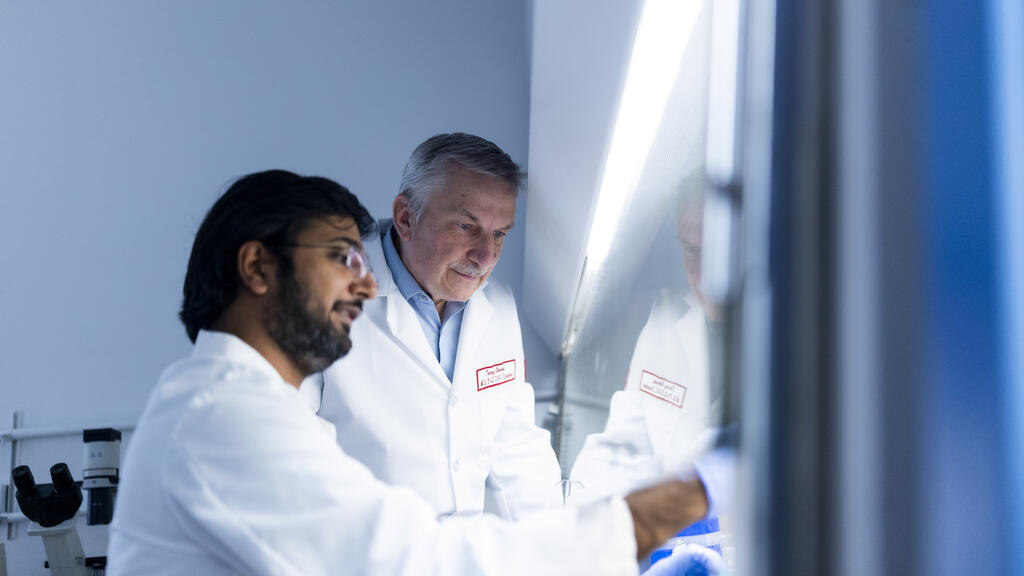 Umeshkumar Vekariya, associate scientist at the Fels Cancer Institute and Tomasz Skorski, director of the Fels Cancer Institute for Personalized Medicine at the Lewis Katz School of Medicine examine cells in the lab.