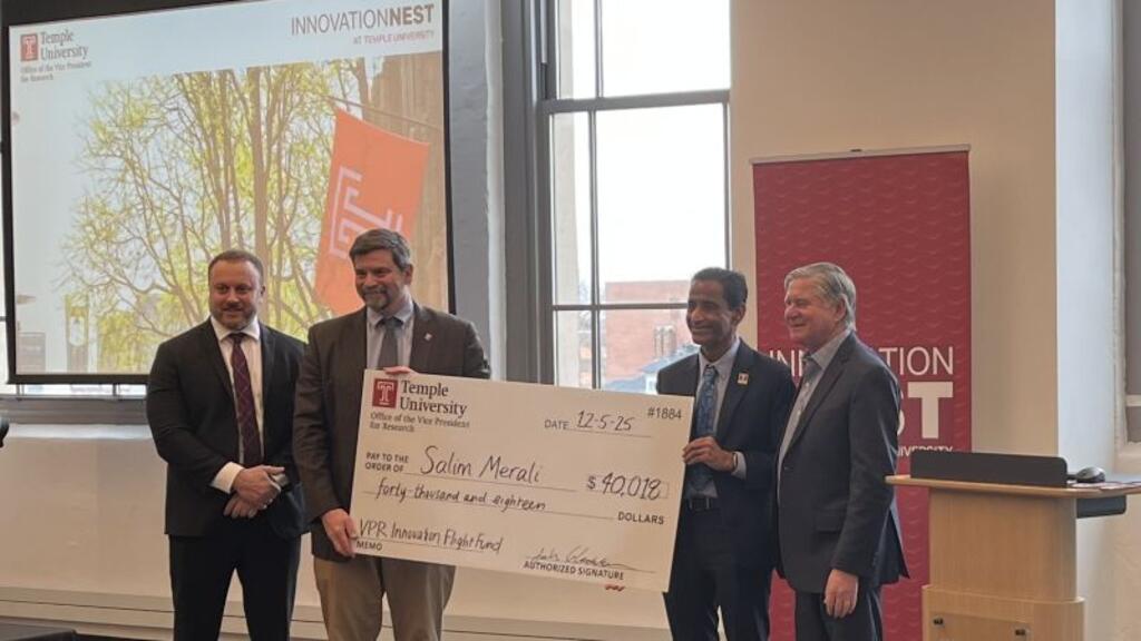 Salim accepting check