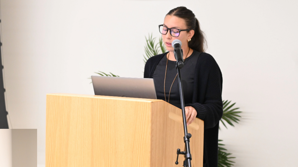 Romina Broglia delivers presentation. 