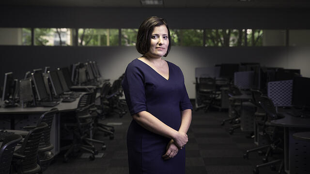 Sara Goldrick-Rab standing in a computer lab.