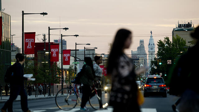 Temple flags on Broad Street with a view of City Hall.