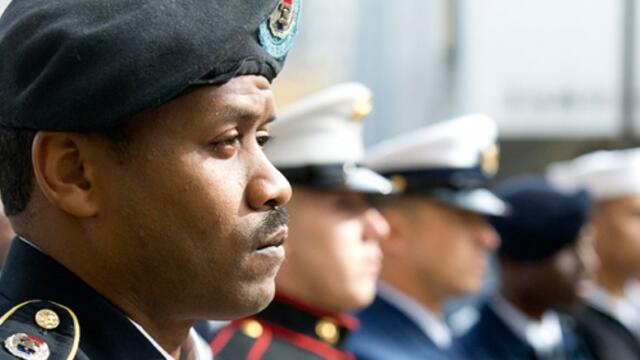 Uniformed service members attending a Temple Veterans Day ceremony.