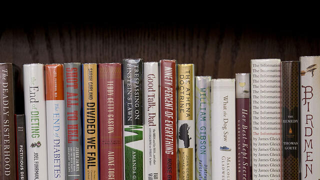 Books on a bookshelf in Samuel Paley Library.