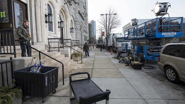 Lighting equipment on the sidewalk outside the Temple Performing Arts Center.