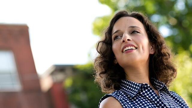Yasmine Mustafa outside, looking into the distance.