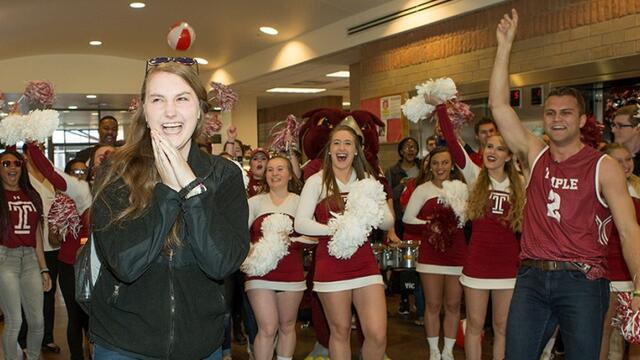 A woman being surprised in a Temple University residence hall.