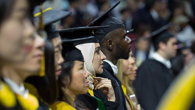 Members of Temple's Class of 2016 wearing Commencement caps and gowns.