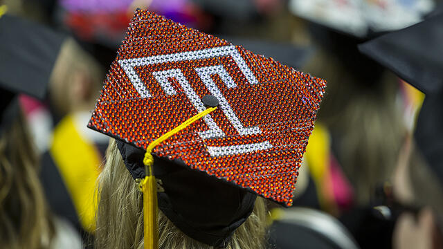 A graduation cap decorated to show the Temple