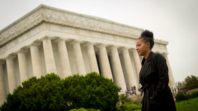 Temple graduate Jamira Burley standing in front of the Lincoln Memorial.