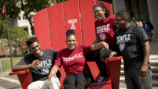 A family sitting together on a TU Big Chair.