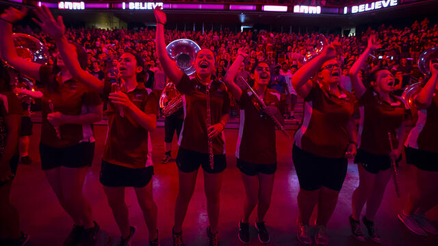 Members of the Diamond Marching Band cheering at Convocation.