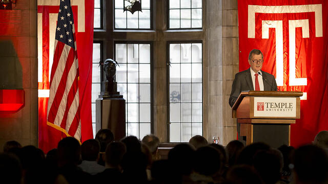 President Richard M. Englert standing at a podium and talking.