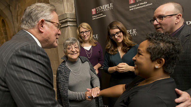 Student Ashley Rodriguez smiling as she meets Tina Fey and others.