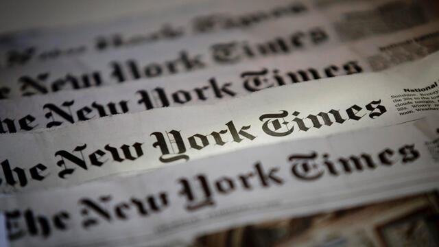 A spread of several New York Times newspapers.