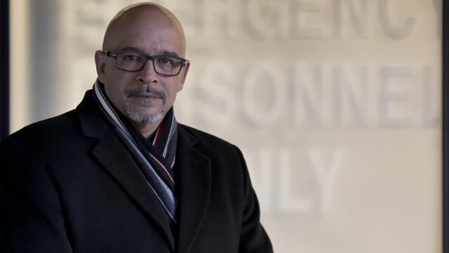 Scott Charles wearing a black suit