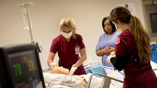 Nursing students working during a simulation