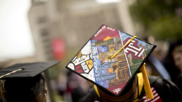 Image of a Temple graduate in their cap.