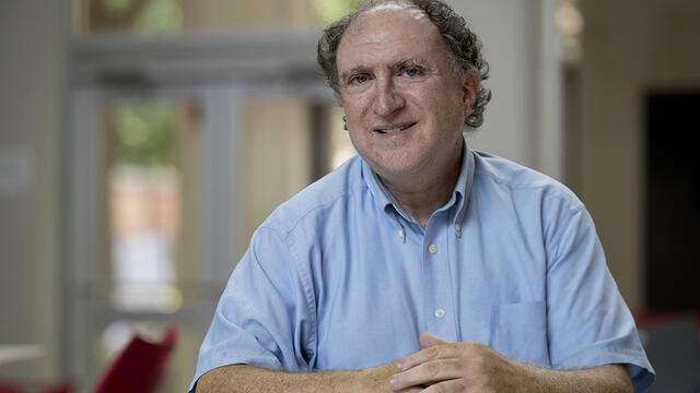 Larry Atkins sitting in the Student Center