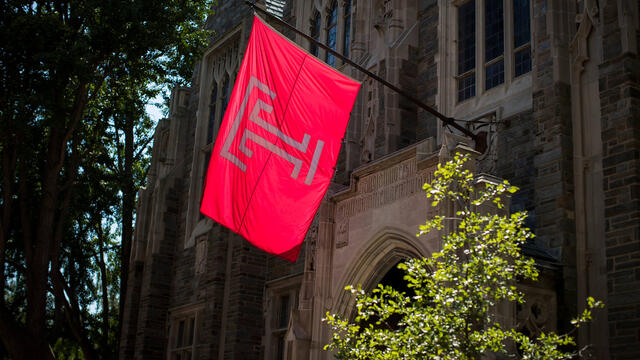 The Temple flag flies outside Sullivan Hall.