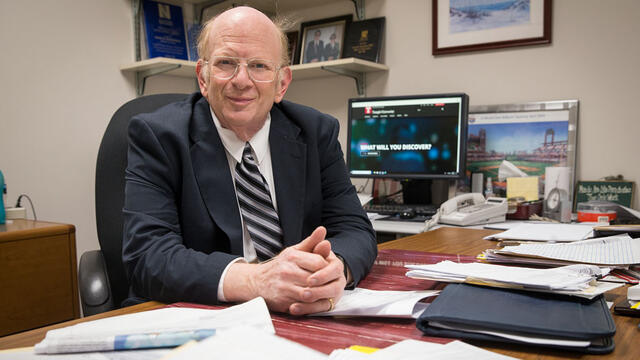Assistant Vice President and Bursar David Glezerman sitting at his desk