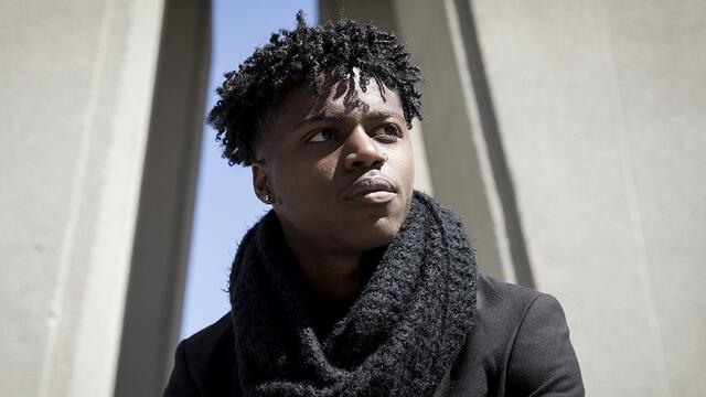 Jamal Parker standing near the Bell Tower.