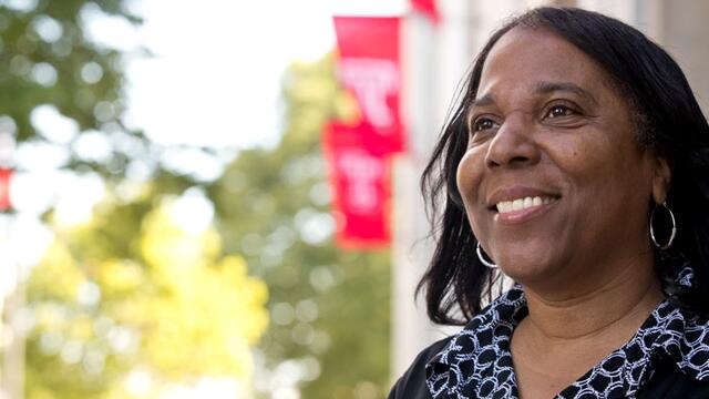 Joan Hankins standing outside the School of Pharmacy