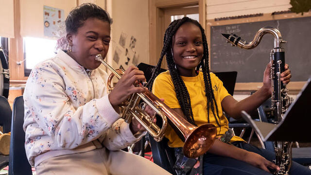 elementary school students playing instruments