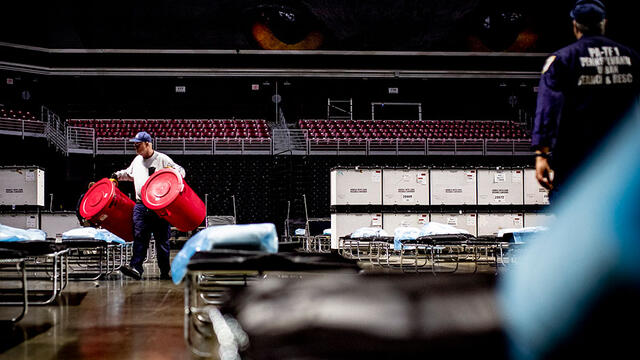 Emergency responders set up a field hospital in the Liacouras Center in March.