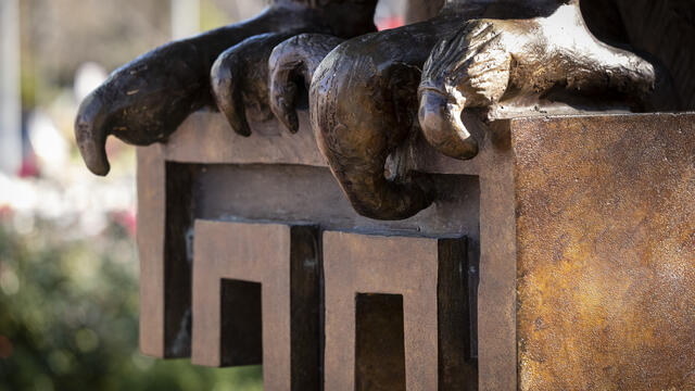 An Owl statue and the Temple T on Main Campus.