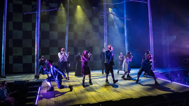 Students sing on stage during a performance of 'Spring Awakening.'