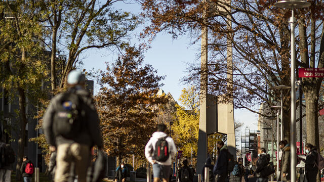 Image of students walking past the Bell Tower on Main Campus.