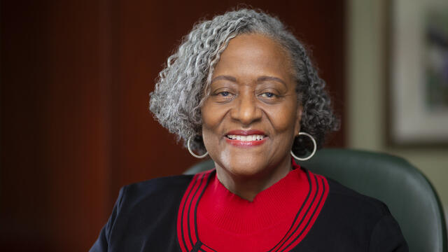 Image of Theresa Powell sitting in a chair.