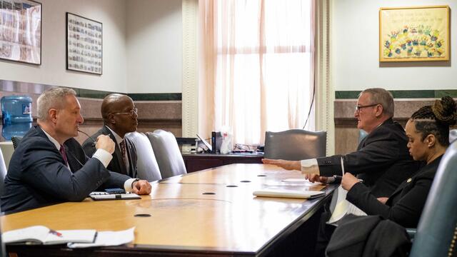 President Wingard at a table with Mayor Kenney and Commissioner Outlaw